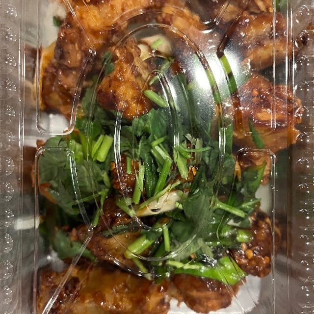 Sizzling Spicy Dry Fish Tilapia with Scallions.